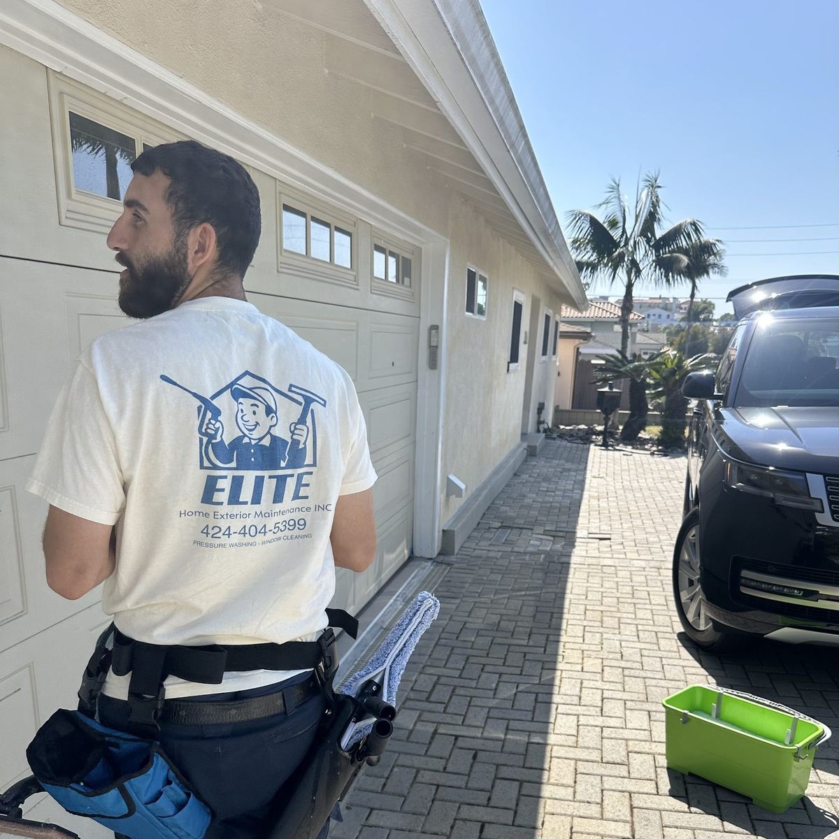 Elite Home Exterior Maintenance technician arriving at a job site