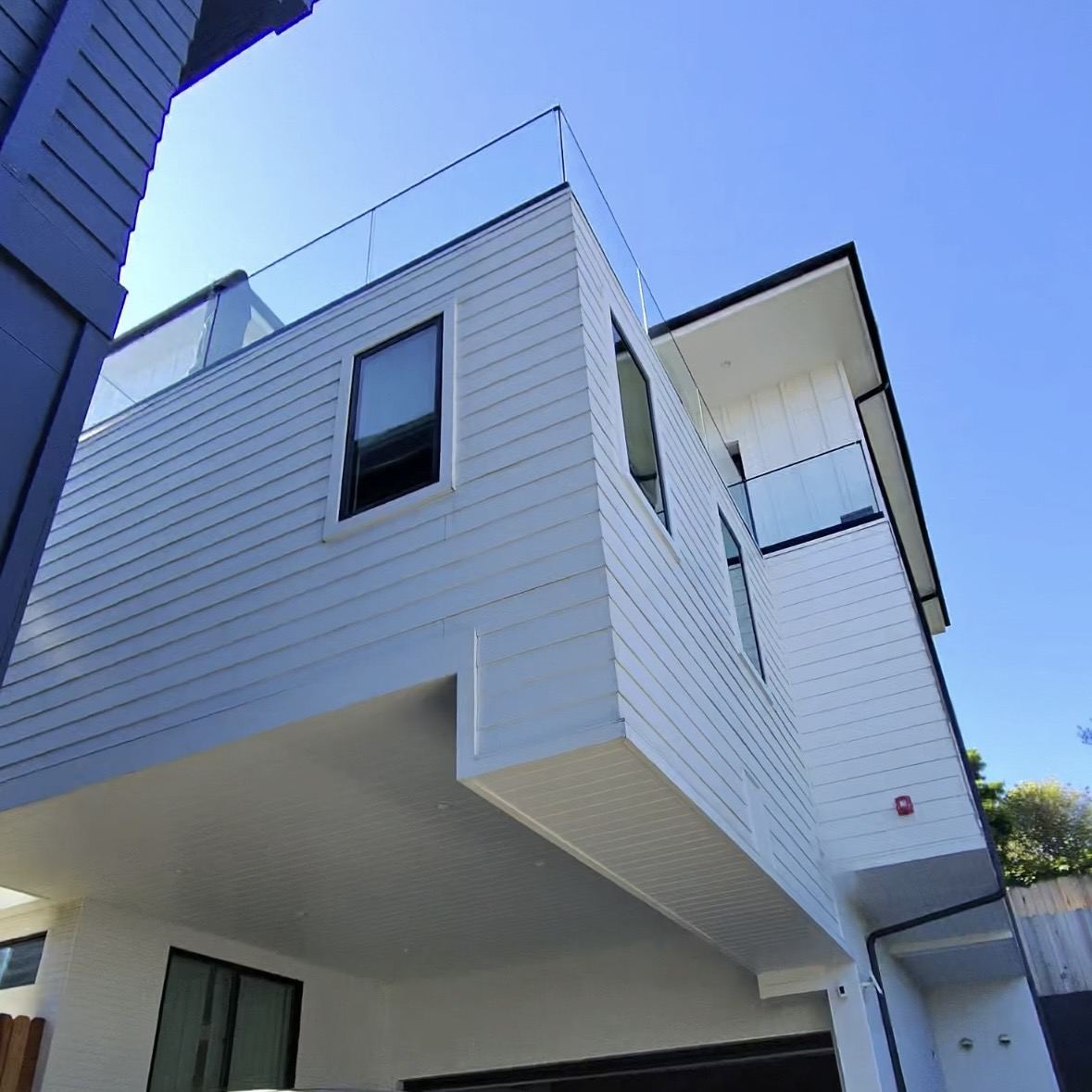 Modern white siding home exterior after a full house wash